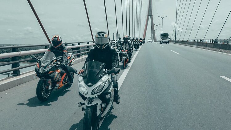 bikers on millau viaduct