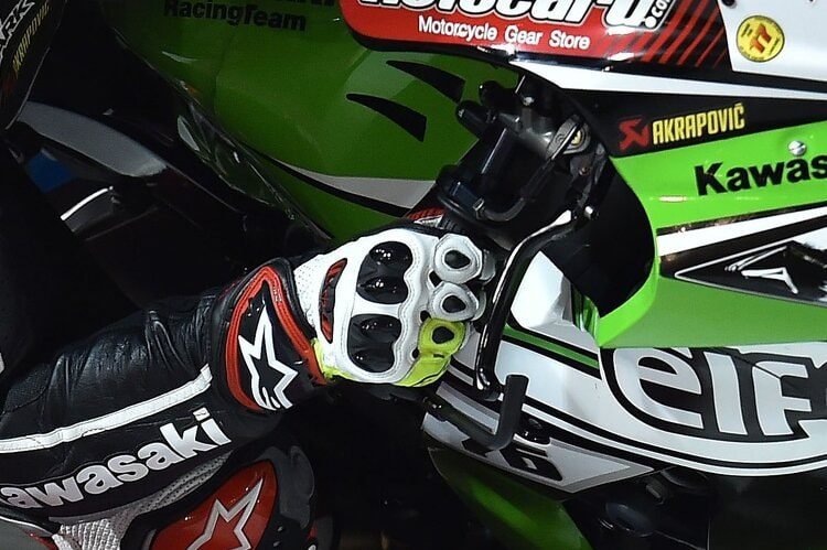 close up of bikers controling throttle - wet weather motorcycle riding