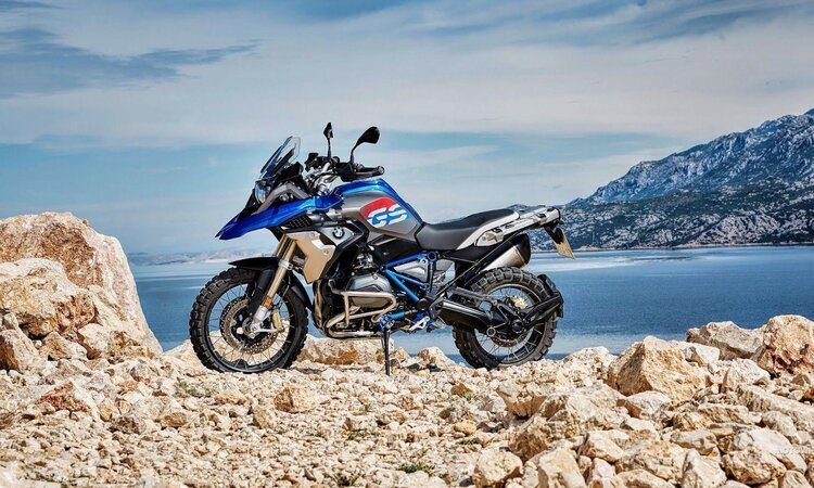 adventure motorcycling on a bmw gs - offroad by lake