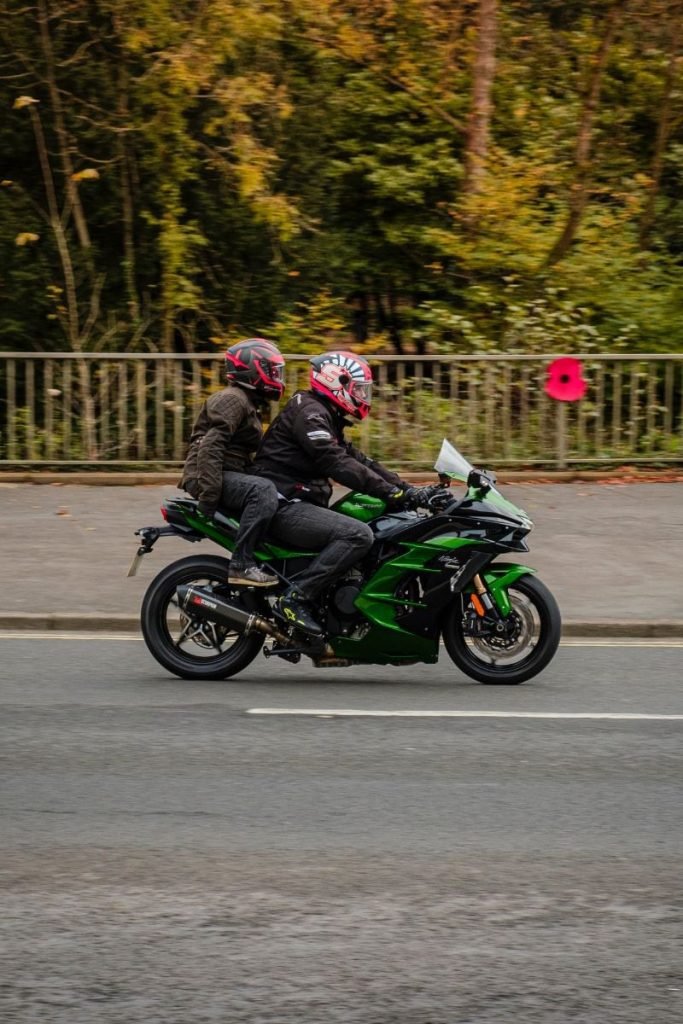 rider and passenger on kawasaki - motorcycle pillion passenger