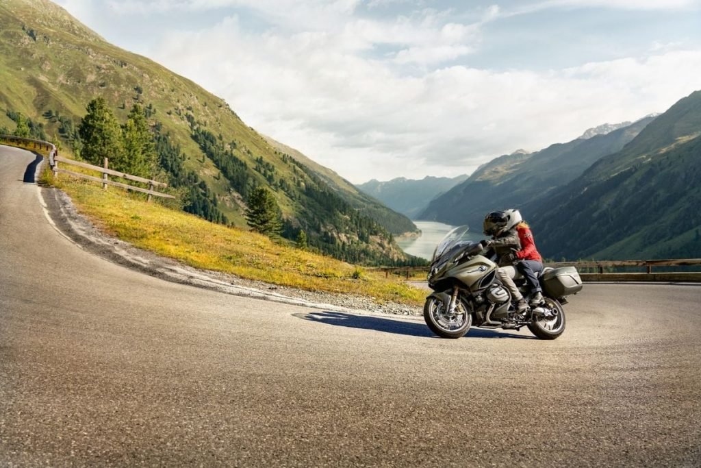 bmw rider and passenger hairpin bend mountains - motorcycle pillion passenger