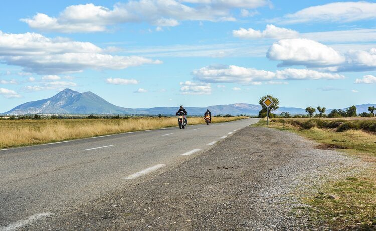 two bikers on mountain road