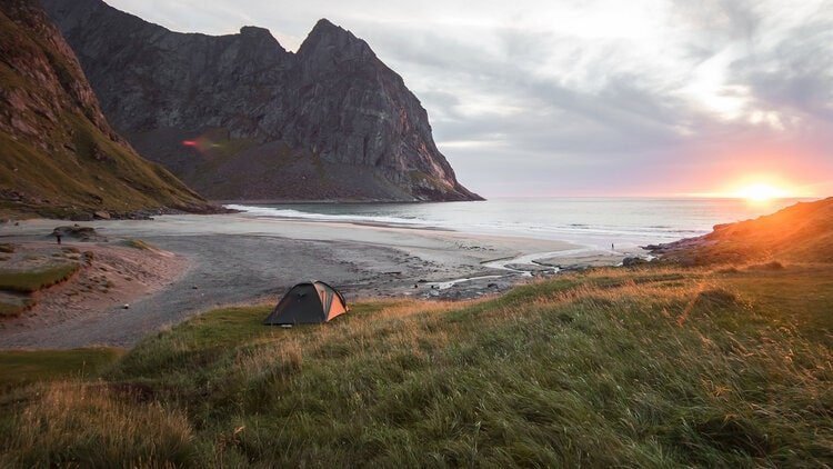 tent on beach at sunrise