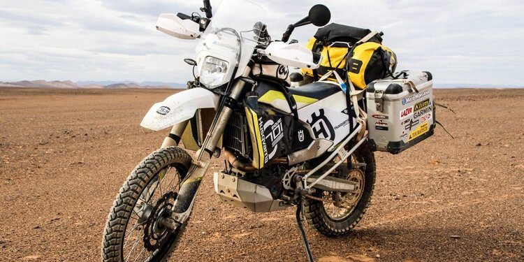 husvarna 701 in desert - best motorcycles to tour around the world