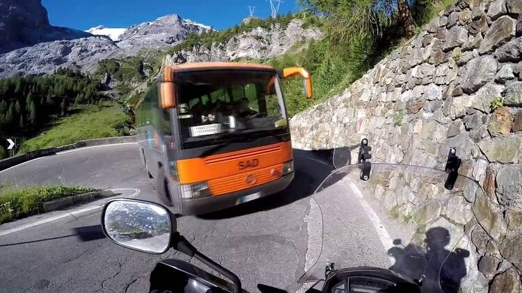 traffic on stelvio pass - cornering a motorcycle