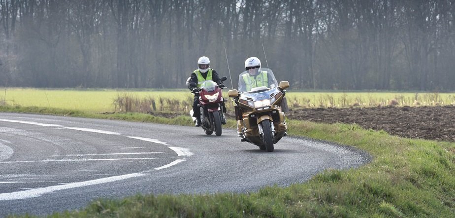 bikers practicing overtakes on each other on winding road