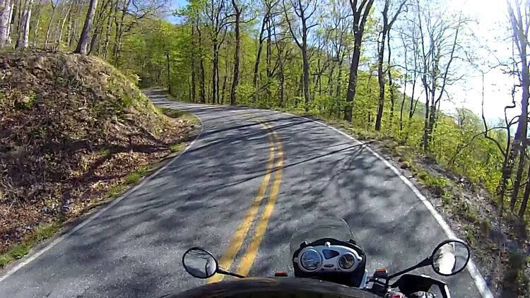 mountain road in spain - listening to music while riding a motorcycle