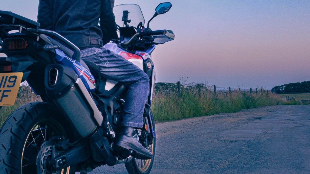 biker on honda africa twin at sunrise