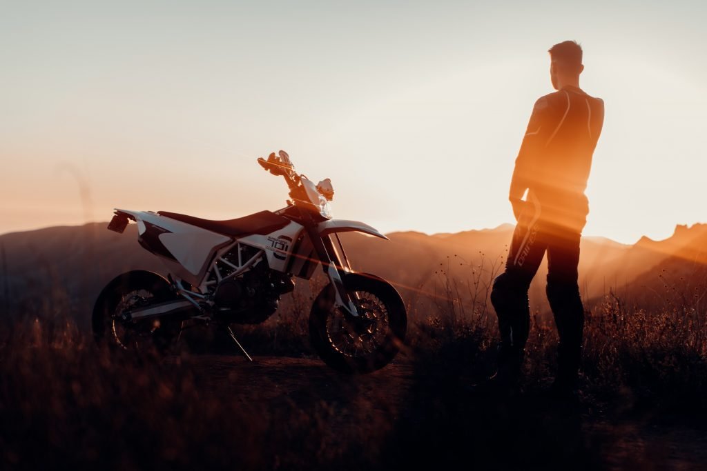 biker in mountains at sunrise