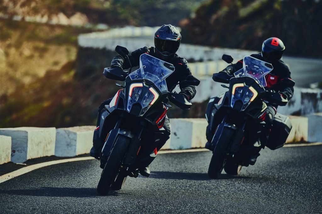 2 ktm motorcycles on twisting road