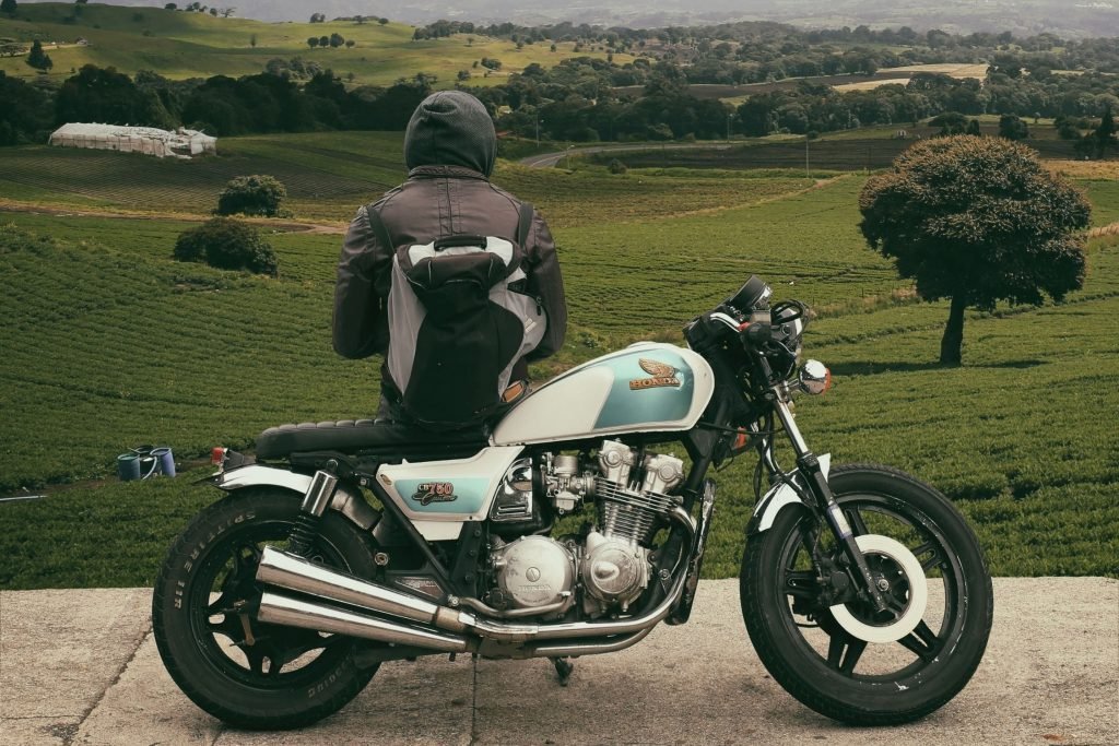honda bike and rider by side of road - motorcycle tour breakdown