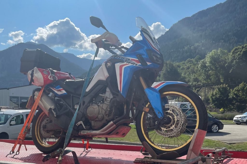 honda africa twin motorcycle on tow truck - Col de l'Iseran
