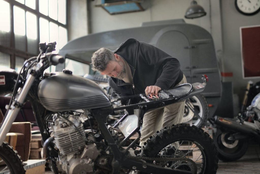 mechanic working on bike