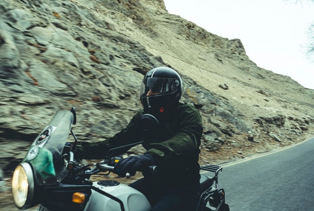 biker looking ahead in mountains