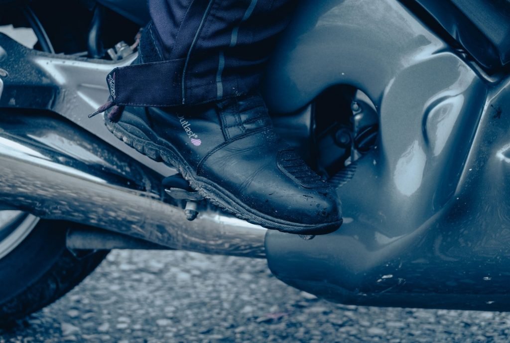 slow-speed riding for motorcycle touring - biker using rear brake