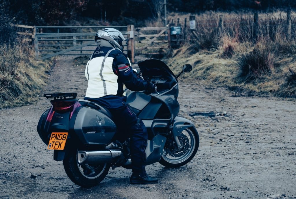 slow-speed riding for motorcycle touring - biker on gravel surface