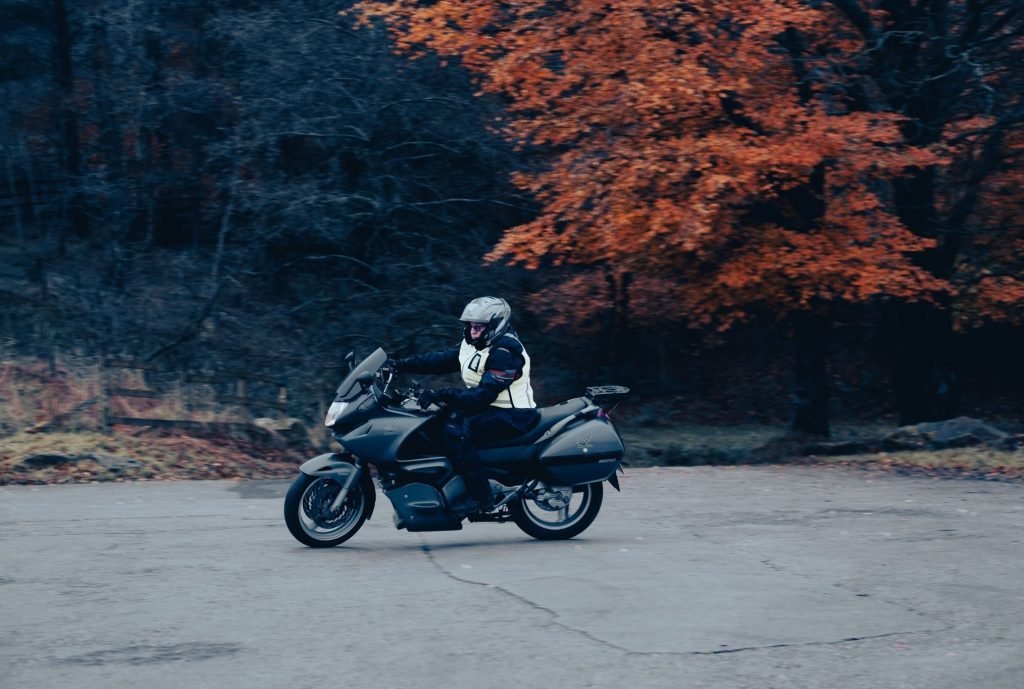 biker practicing in car park