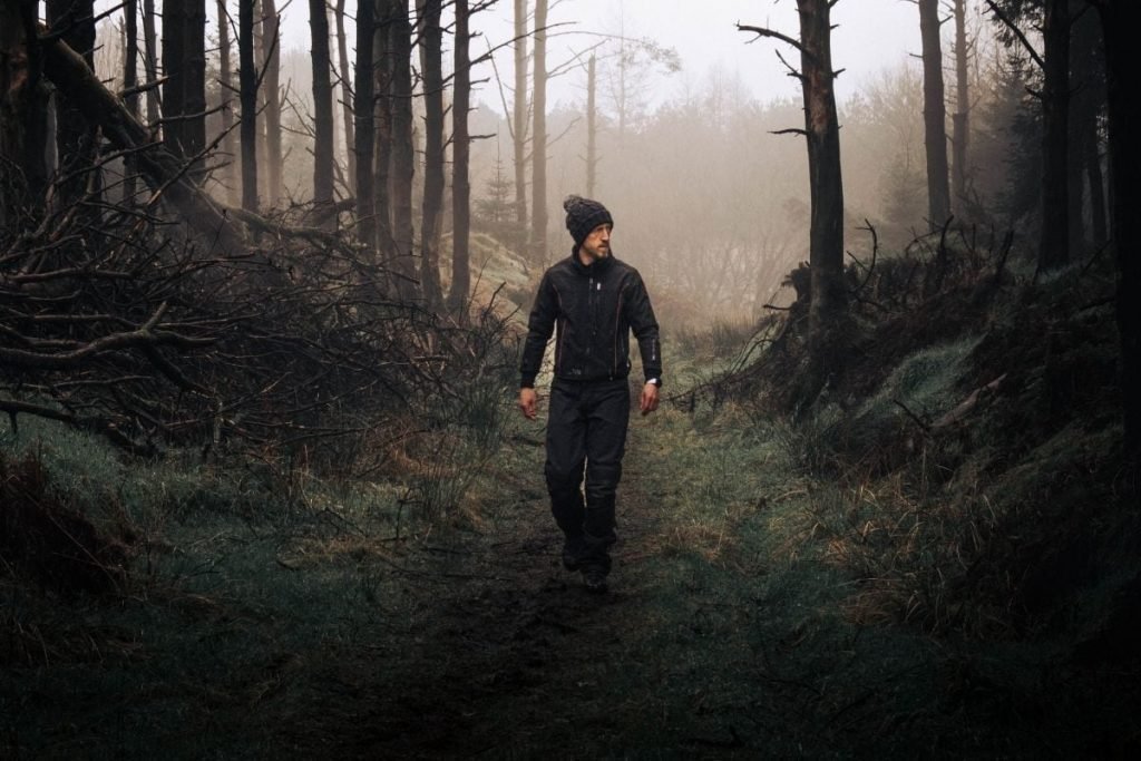 rider wearing keis heated jacket in forest scene