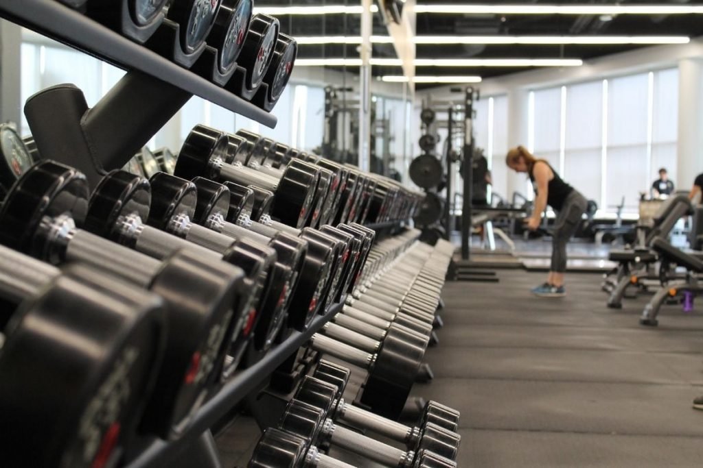stay fit on your motorcycle tour - woman in gym