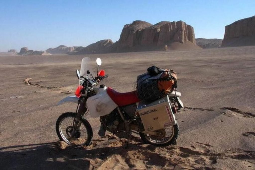 dirt bike in desert - reasons not to buy panniers