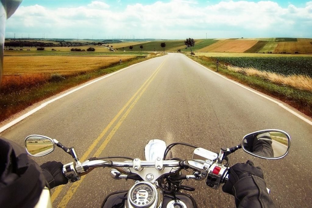 yamaha cruiser on winding road through fields