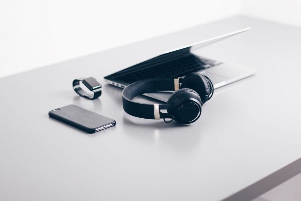 laptop, watch, headphones and smartphone - non-motorcycling items