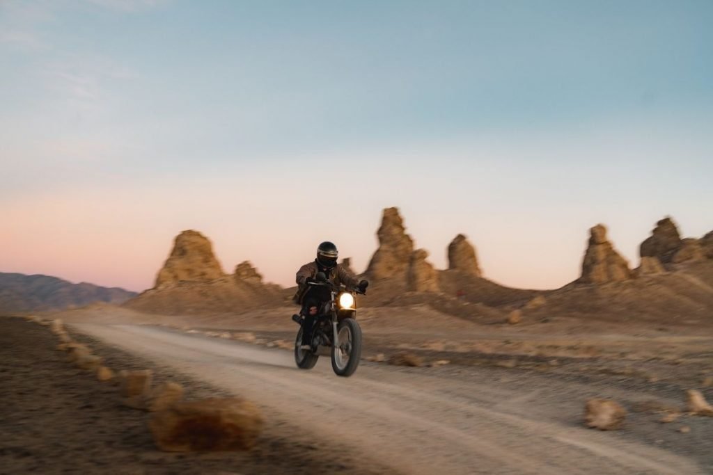 biker off-roading through desert - extra fuel on a motorcycle