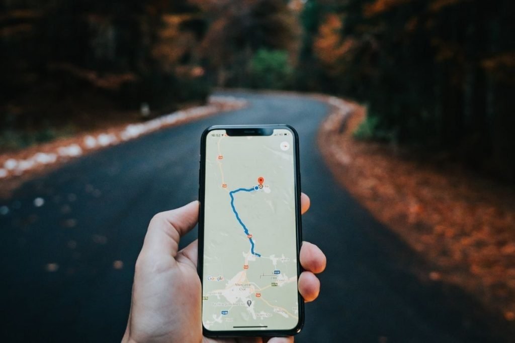 google maps on smartphone on curvy road - motorcycle touring accessories