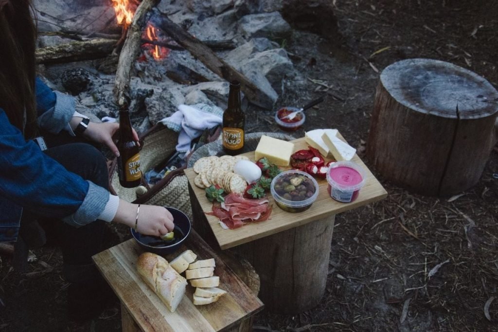 preparing camping food in the wilderness - motorcycle touring on a budget