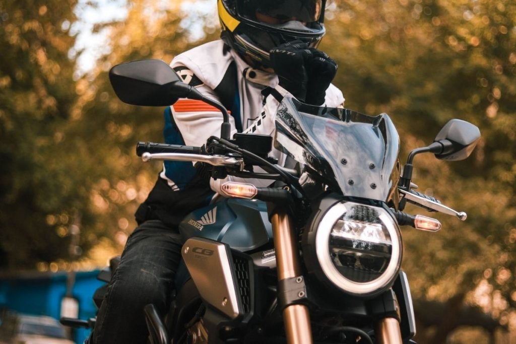 rider leant on honda motorbike