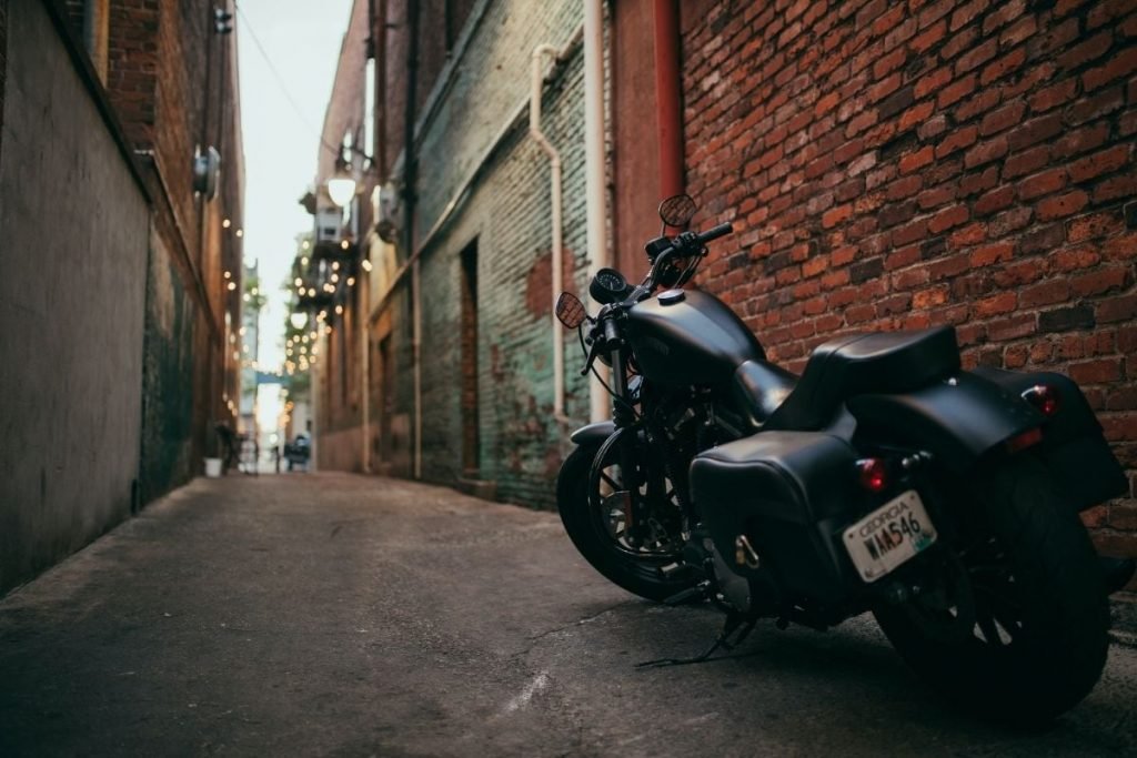 cruiser in back alley - touring on a motorcycle