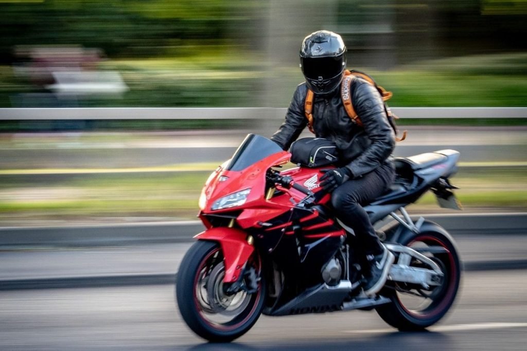 rider taking it easy - cut costs on your motorcycle trip