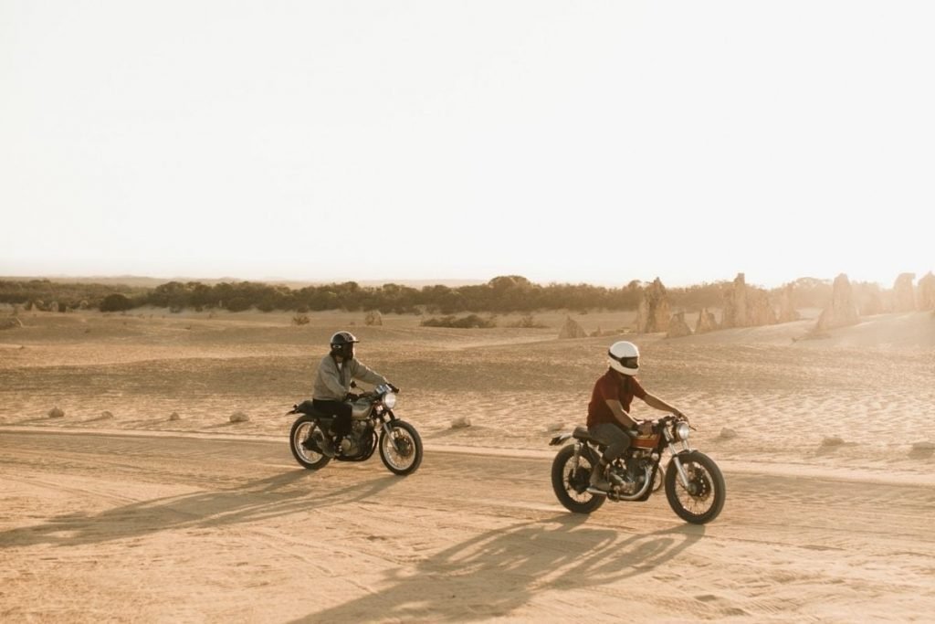 riders in desert - motorcycle touring for beginners