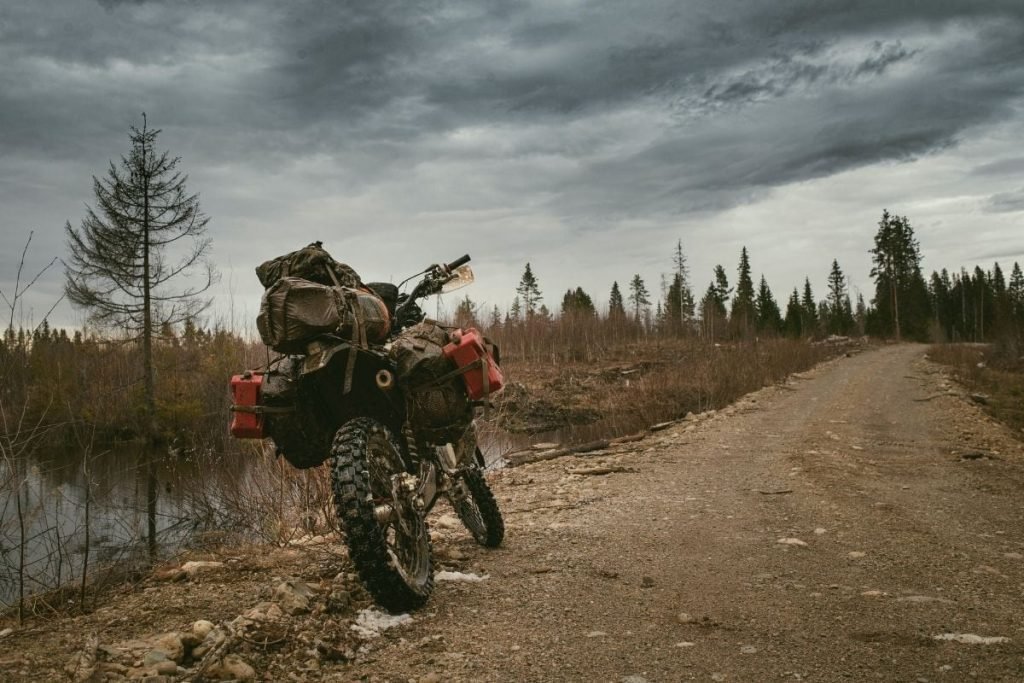motorcycle off road with moody sky - best tank bags