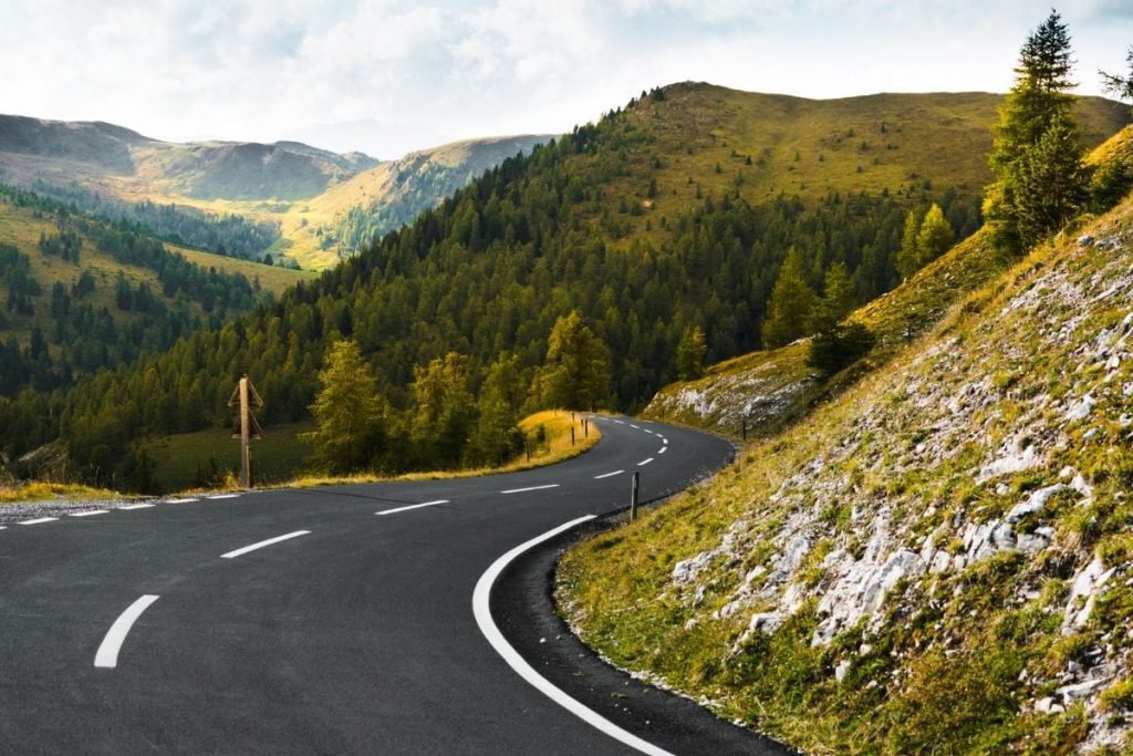 motorcycle routes france - winding road through mountains