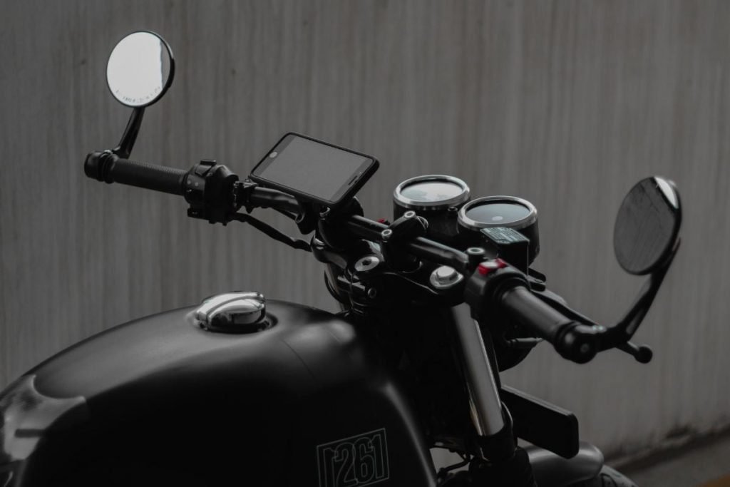 best motorcycle smartphone holders - black motorcycle with phone and mount