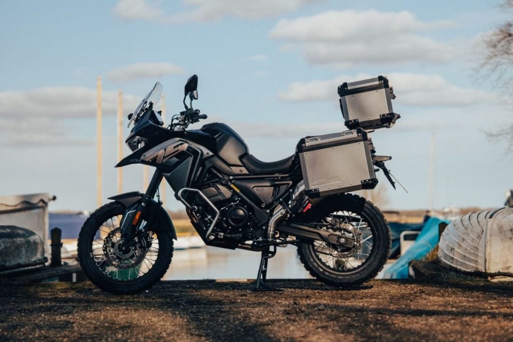 adventure motorbike with luggage on shore