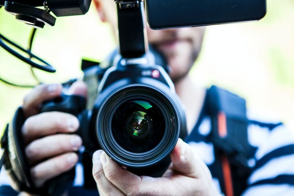 photographer with camera - motorcycle photography tips