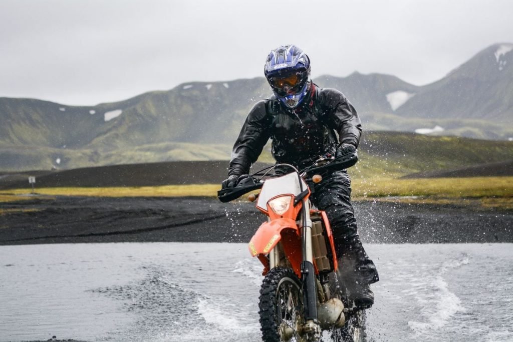 dirt bike with mountains in background - motorcycle photography tips