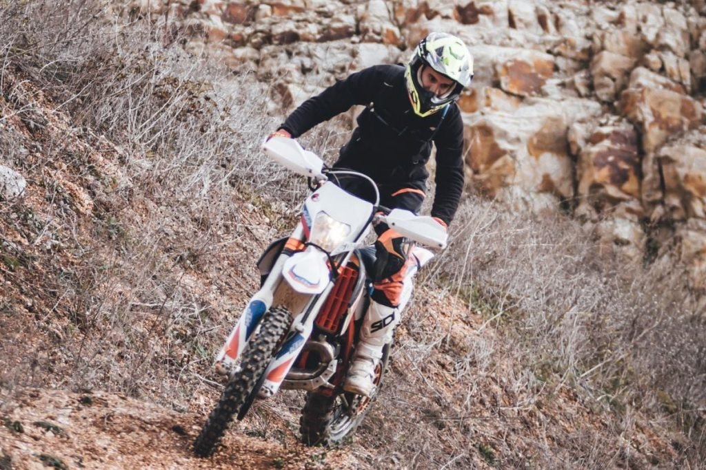 dirt bike on mountain - motorcycle photography tips