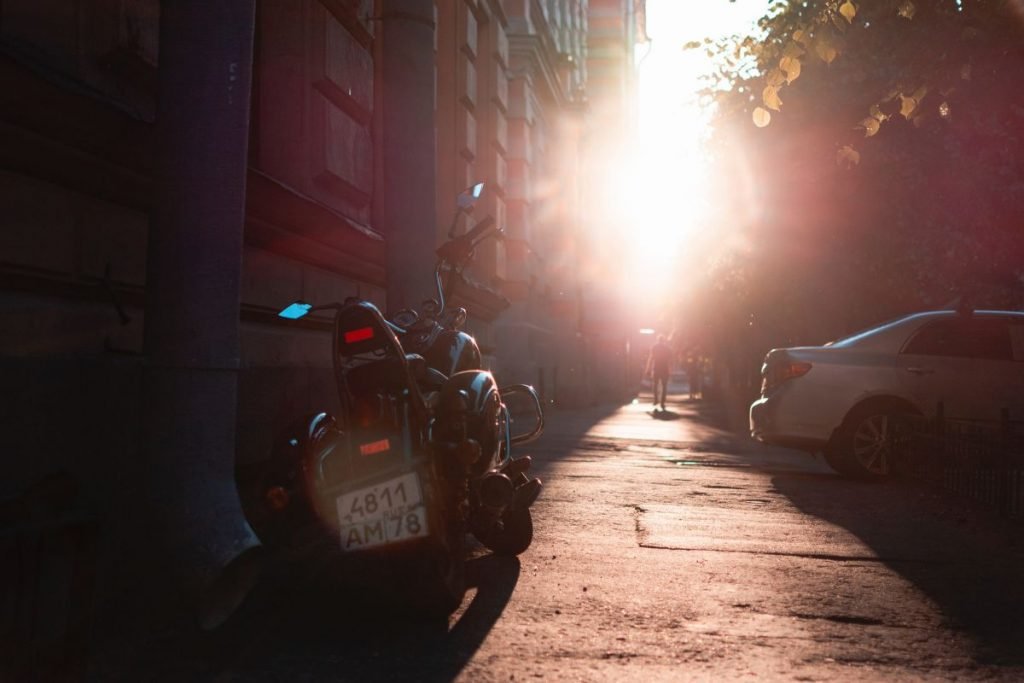 motorcycle in city back street on break - riding motorcycle heat