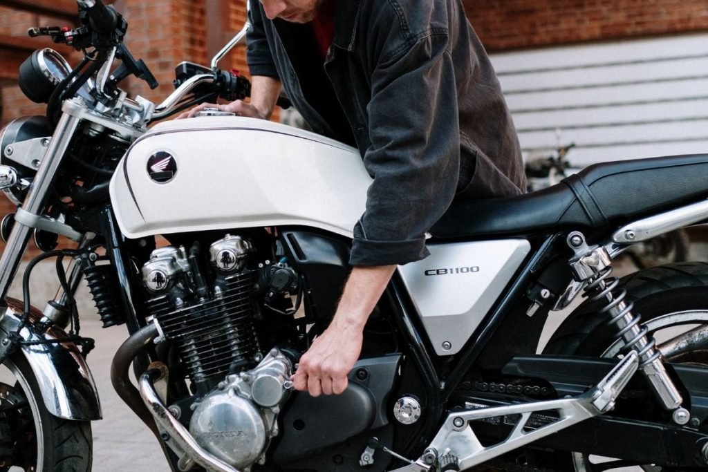 mechanic with honda motorcycle