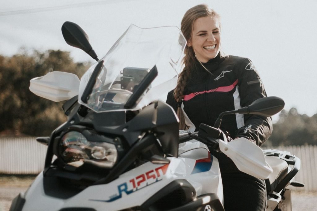 female rider on bmw - women's textile motorcycle jacket