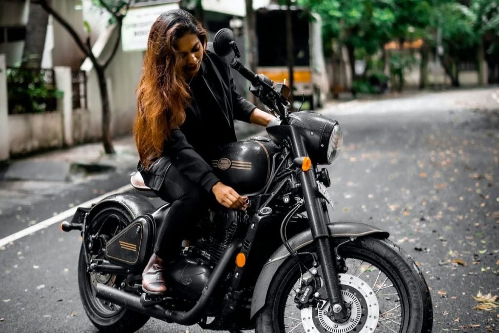 men's and women's motorcycle boots - woman rider on vintage bike