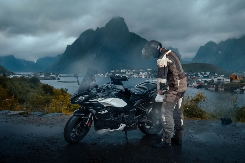 rider in lofoten in the rain