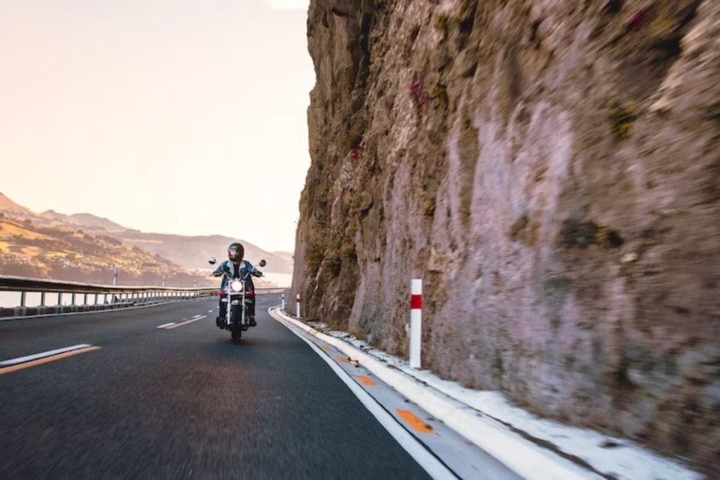 rider by canyon and lake